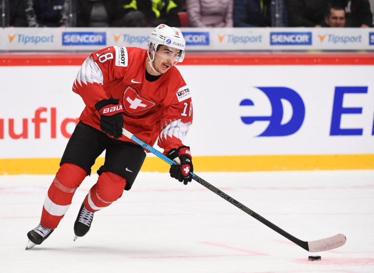TRINEC, CZECH REPUBLIC - DECEMBER 28: Switzerland Valentin Nussbaumer #18 skates with the puck against Sweden during preliminary round action at the 2020 IIHF World Junior Championship at Werk Arena on December 28, 2019 in Trinec, Czech Republic. (Photo by Matt Zambonin/HHOF-IIHF Images)