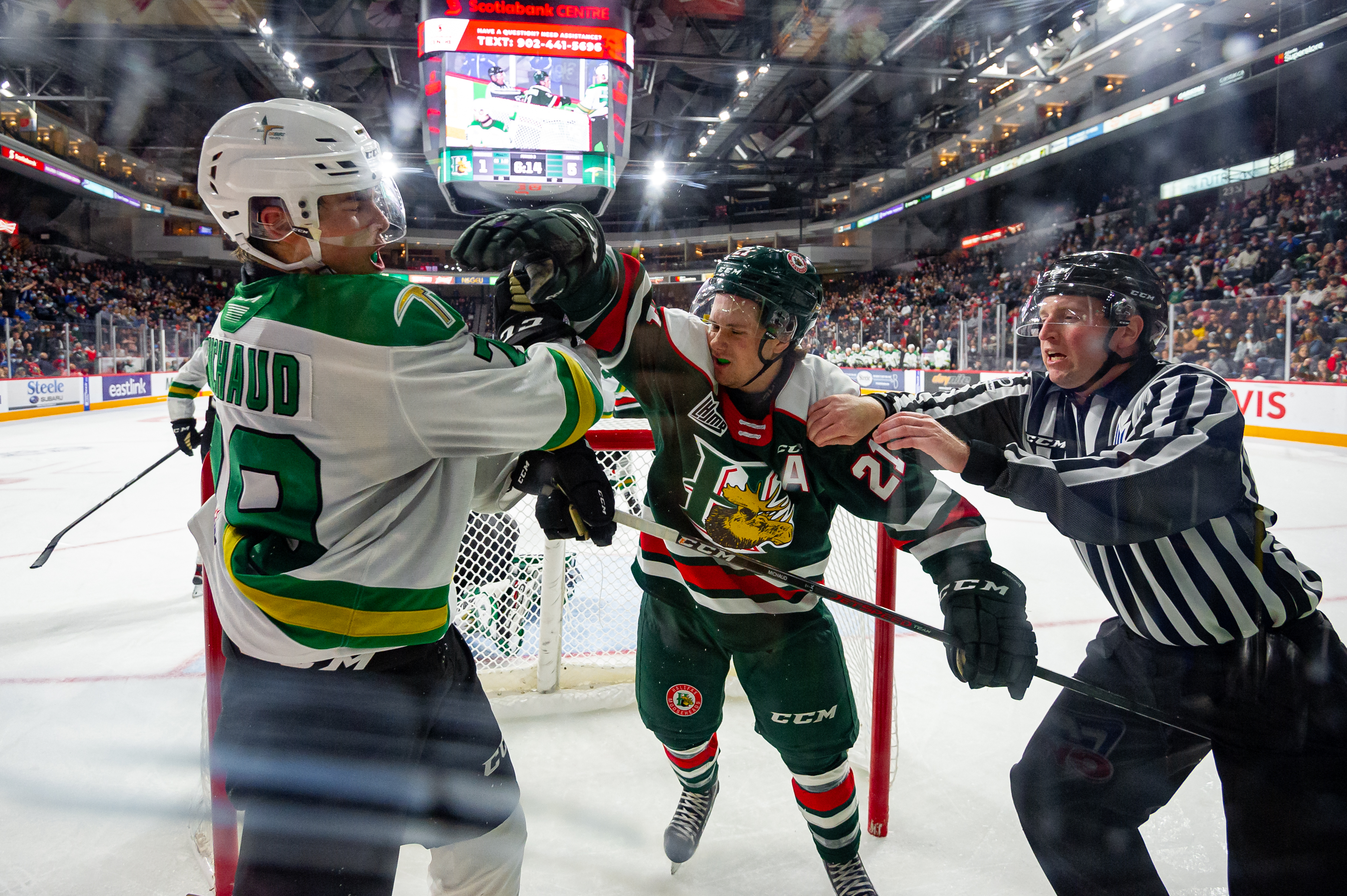 Halifax, Nova Scotia - Oct 23, 2021: Halifax Mooseheads C, Zachary Beauregard (21) mixes it up with Val-d'Or Foreurs RW, Zackary Michaud (79) during the game between Halifax Mooseheads and Val-D'Or Foreurs at the Scotiabank Center in Halifax, Nova Scotia. (Trevor MacMillan/Halifax Mooseheads)