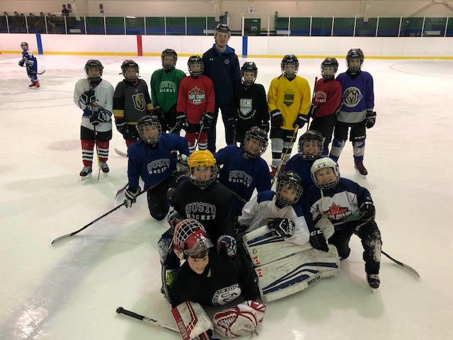 Sea Dogs Defenceman Kale McCallum helps out with a KV Atom A Sabres practice.